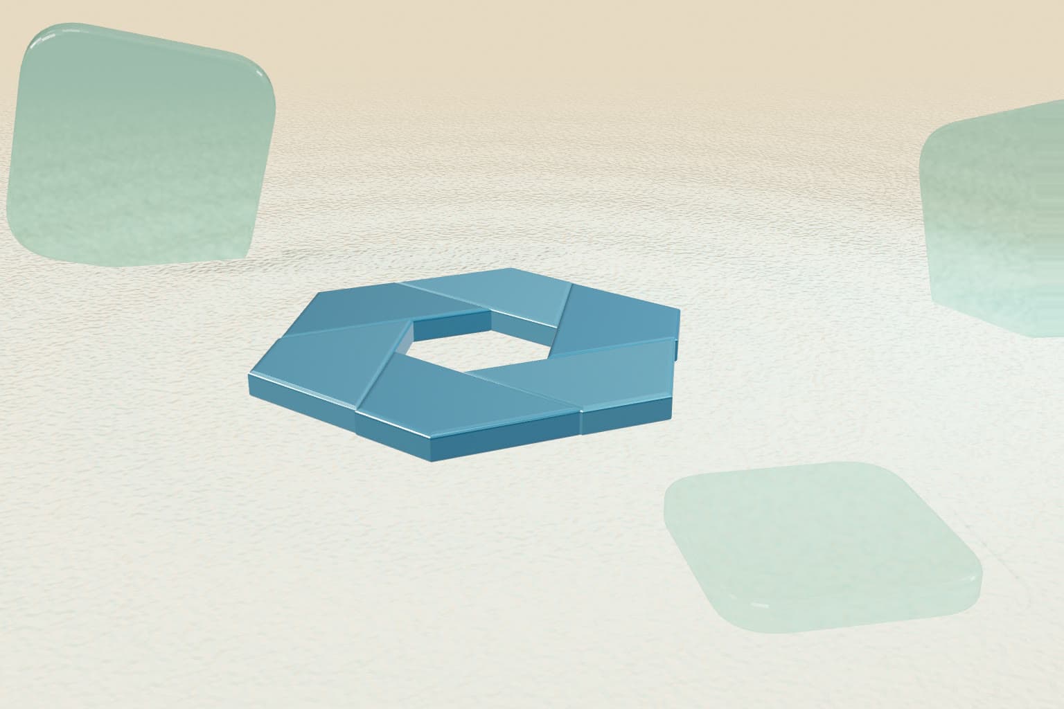 The Enkeon aperture resting on sand among frosted glass tiles